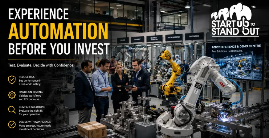 Manufacturing business owners testing industrial robots in a robot experience centre before investing in automation solutions.